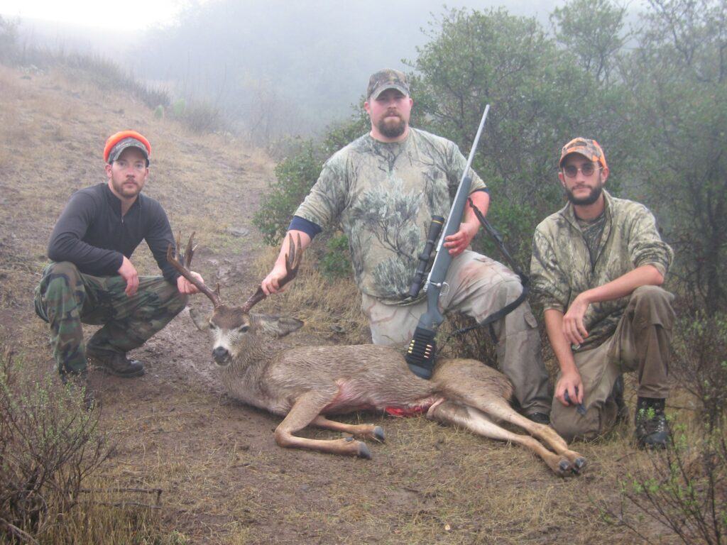 Former Conservancy Invasive Plant Manager and Hunting Guide Charlie de la Rosa leading a deer hunt on Catalina Island.