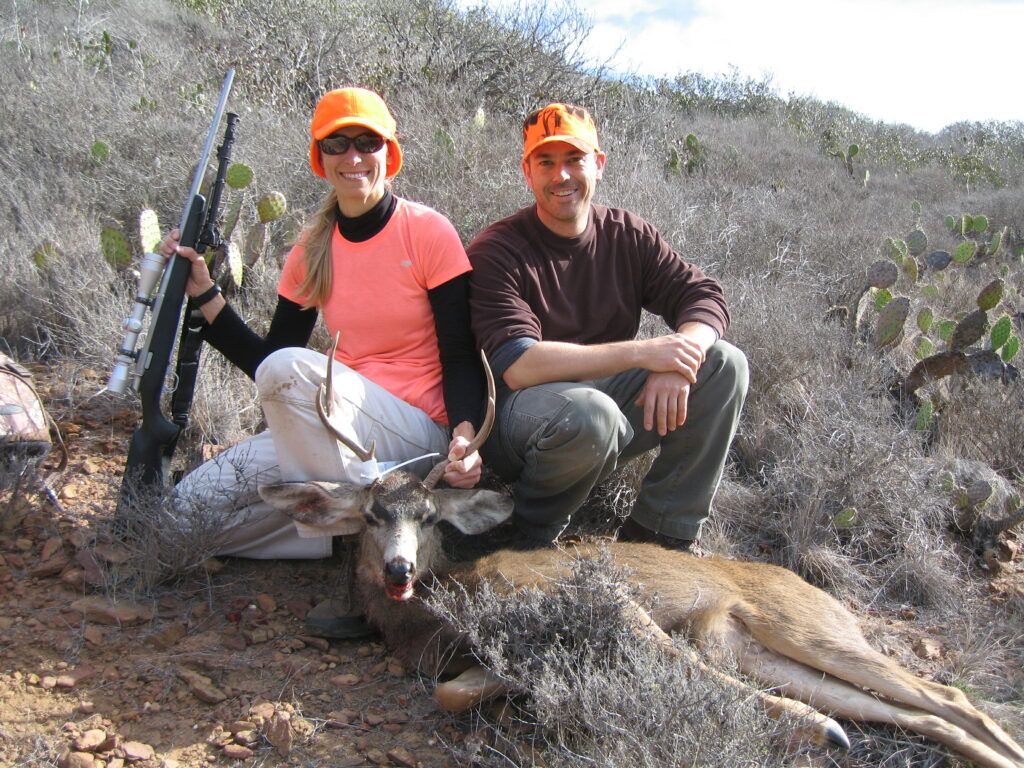 Former Conservancy Director of Conservation Julie King, and former Conservancy Wildlife Biologist Calvin Duncan (me) posing with a deer Julie harvested on Catalina Island, California.